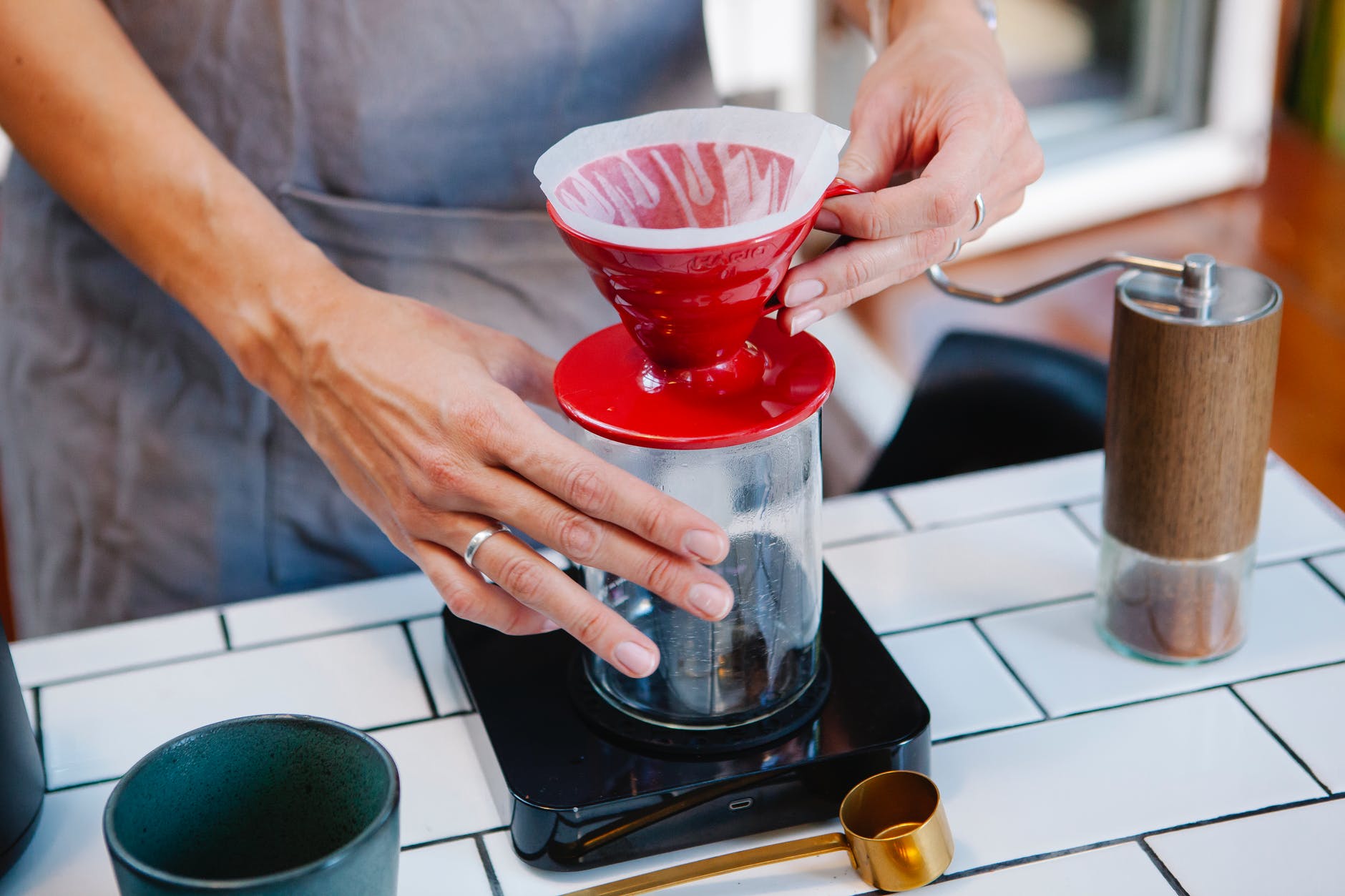 woman barista preparing fresh alternative coffee in cafe